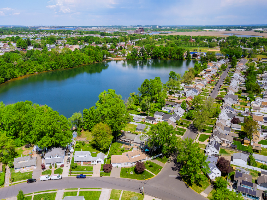 Aerial panorama view of the residential Sayreville town area of beautiful suburb of dwelling home near lake from a height in New Jersey